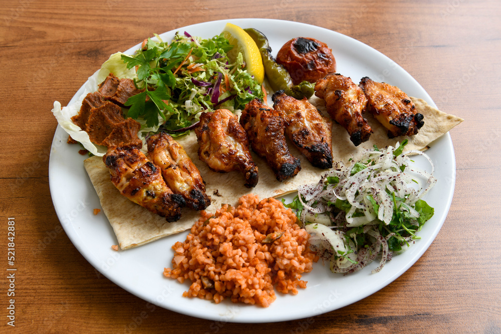 Chicken wings barbeque in a dish with BBQ grill sauce . Izgara tavuk kelebek sis kanat. Tavuk sis, gogus. Chicken wings barbeque in a dish with BBQ grill sauce . Izgara tavuk kelebek sis kanat. Tavuk sis, gogus.