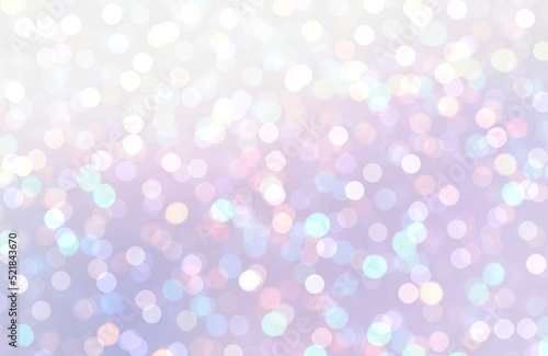 Brilliance bokeh lights on blue lilac pastel background for winter holidays decor. Glittering texture.