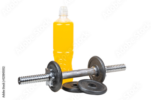 Dumbbell with pancakes and a plastic bottle of isotonic drinks with orange flavor isolated on a white background