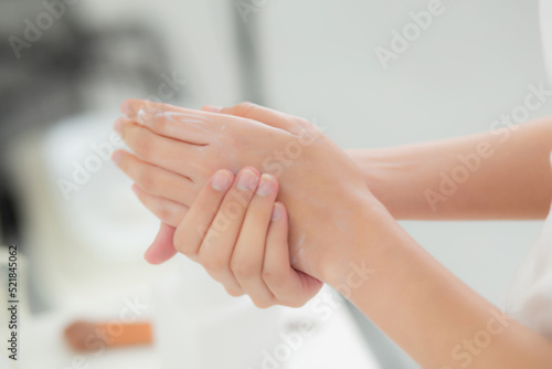 Closeup hands of woman applying moisturizer cream and lotion with hands for skin protection, skincare and cosmetic, treatment and bodycare for hygiene, touch hands with smooth, skin care concepts. © N_studio