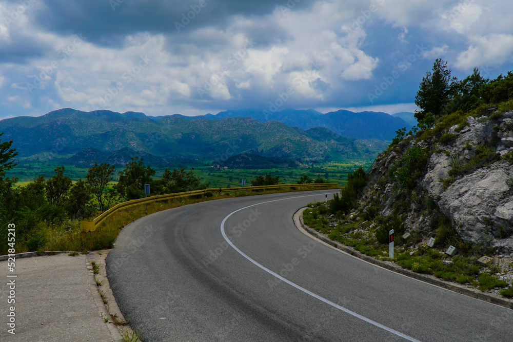 Naklejka premium Turning a road in the mountains with a view of the beautiful mountains of southern Croatia
