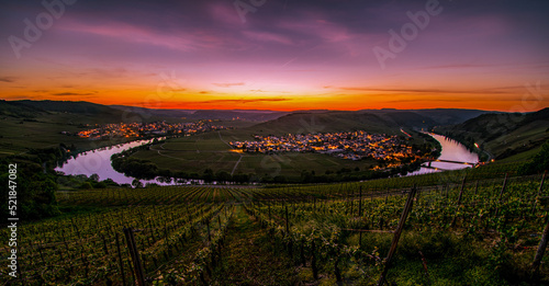 Far view over Mosel loop with vineyards in foreground during spectacular colorful sunset near Leiwen  Germany
