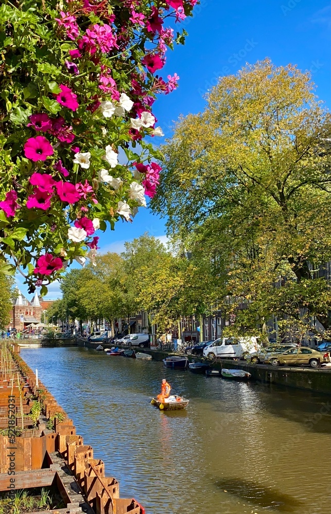 Naklejka premium Boating through Amsterdam Canals
