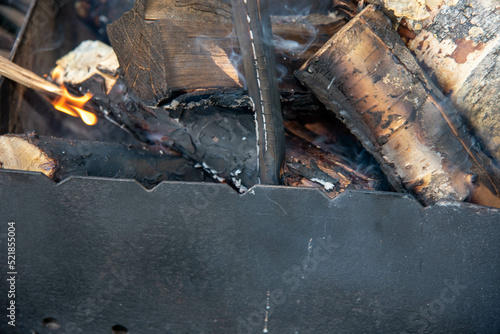 wood burn in a black grill 