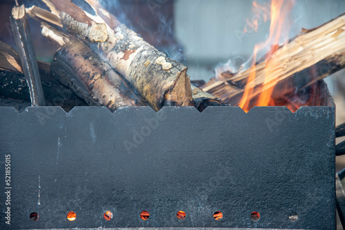 wood burn in a black grill 