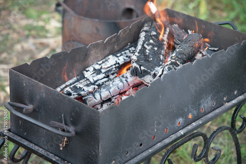 coal in a  black  grill