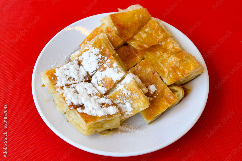 Homemade burek (borek) with cheese and spinach and boiled egg.Traditional food. Peynirli, Patatesli, kiymali kol boregi. Homemade burek (borek) with cheese and spinach and boiled egg.Traditional food. Peynirli, Patatesli, kiymali kol boregi.