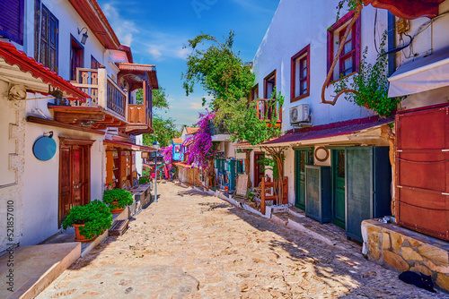 Fototapeta Naklejka Na Ścianę i Meble -  Old colored street view. Houses with wooden balconies in Kas city, Turkey