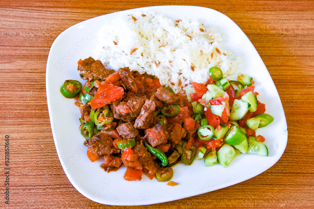 Beef steak grill with rice pilaf, fried potatoes, grilled pepper and tomatoes.Mix Platter with Beef rips, Cutlets, Potatoes and Sauces. Beef steak grill with rice pilaf, fried potatoes, grilled pepper and tomatoes.Mix Platter with Beef rips, Cutlets, Potatoes and Sauces.