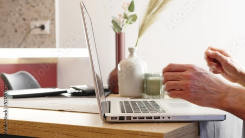 Typing on the computer. Man's hands typing on a laptop keyboard.