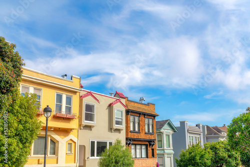 Two-storey townhomes exterior with colorful wall sidings in the suburbs of San Francisco, California