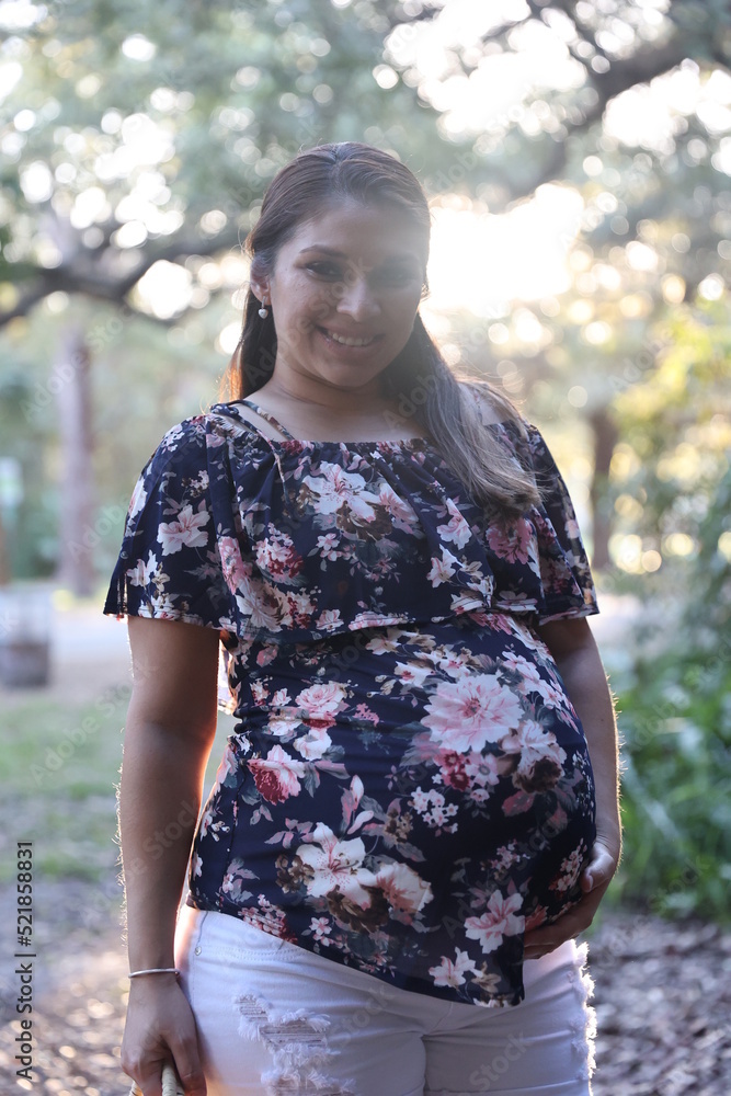 Miami, Florida / United States – December 31, 2021: Maternity Photoshoot in a Park Miami, Florida / United States – December 31, 2021: Maternity Photoshoot in a Park