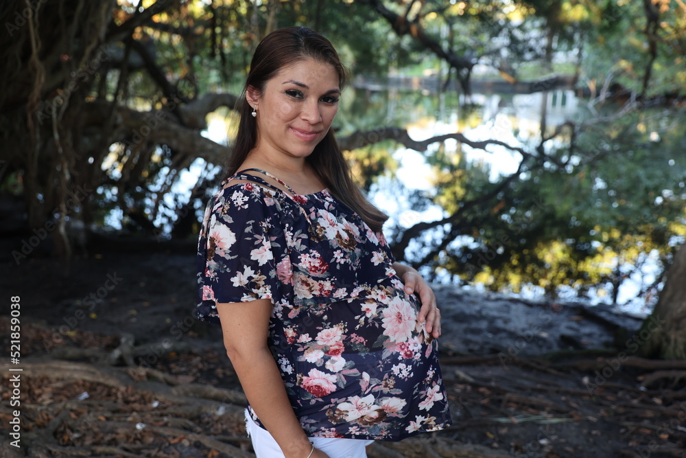 Miami, Florida / United States – December 31, 2021: Maternity Photoshoot in a Park Miami, Florida / United States – December 31, 2021: Maternity Photoshoot in a Park