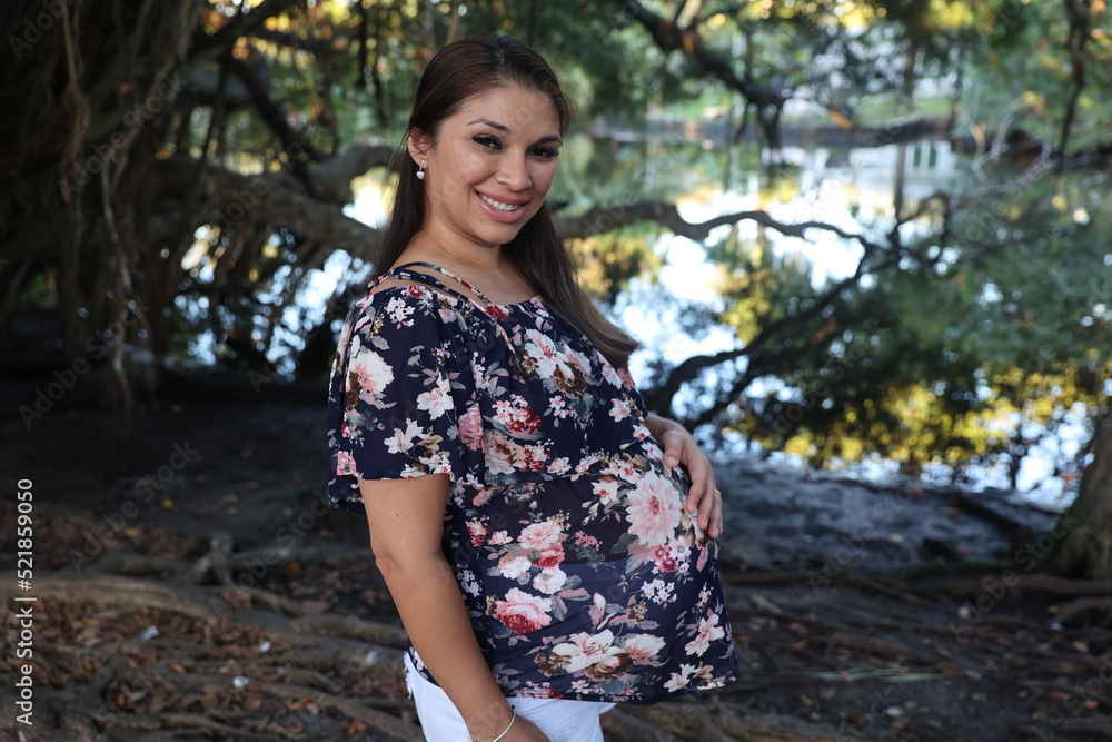 Miami, Florida / United States – December 31, 2021: Maternity Photoshoot in a Park Miami, Florida / United States – December 31, 2021: Maternity Photoshoot in a Park