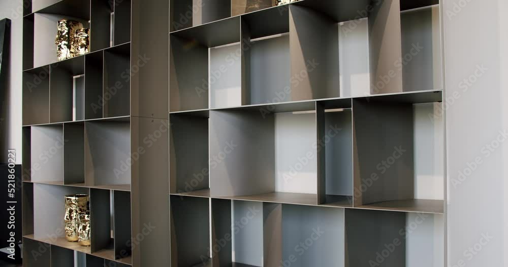 Shelves with home stuff. minimalist furniture. Minimalist brown shelf. Minimalist bookshelf. Modern Furniture and cozy design. Home modern black shelf. Modern interior of the living room furniture. Shelves with home stuff. minimalist furniture. Minimalist brown shelf. Minimalist bookshelf. Modern Furniture and cozy design. Home modern black shelf. Modern interior of the living room furniture.