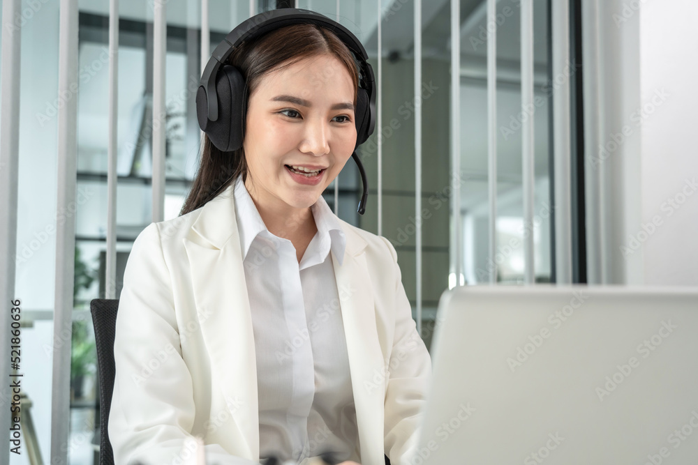 Female call center provides information to a customer calling for help, Contact us, Service with a beautiful and friendly voice, Long distance communication, Talk using headphones or headsets Female call center provides information to a customer calling for help, Contact us, Service with a beautiful and friendly voice, Long distance communication, Talk using headphones or headsets
