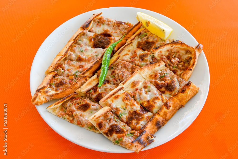 Turkish pita with minced cubed meat and cheese (Turkish name: Kiyma Kusbasi kasarli pide) Turkish pita with minced cubed meat and cheese (Turkish name: Kiyma Kusbasi kasarli pide)