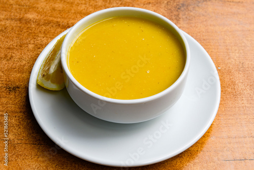 Lentil   mercimek   soup with melted butter and red pepper sauce. Mercimek corbasi