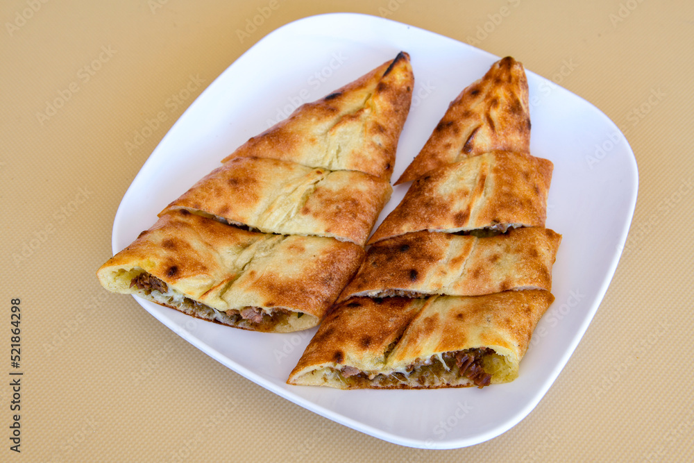 Turkish pita with minced cubed meat and cheese (Turkish name: Kiyma Kusbasi kasarli pide)