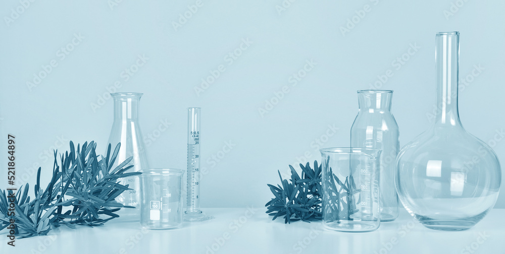 Natural drug research banner, Organic and scientific extraction in glassware, Alternative green herb medicine, Natural skincare beauty products, Laboratory and development concept.