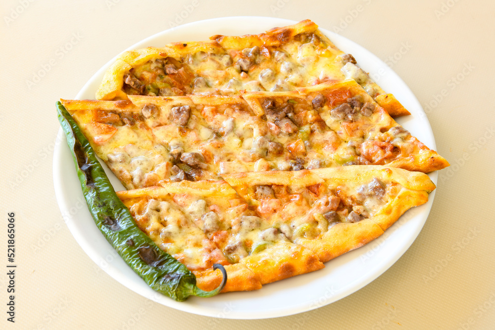 Turkish pita with minced cubed meat and cheese (Turkish name: Kiyma Kusbasi kasarli pide) Turkish pita with minced cubed meat and cheese (Turkish name: Kiyma Kusbasi kasarli pide)