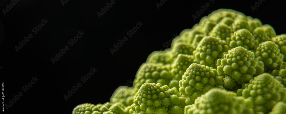 Romanesco broccoli head on a dark stone surface, cabbage, close up, fibonacci sequence, for those who love mathematics Romanesco broccoli head on a dark stone surface, cabbage, close up, fibonacci sequence, for those who love mathematics