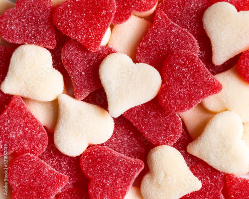Closeup of red and white candy gummy hearts