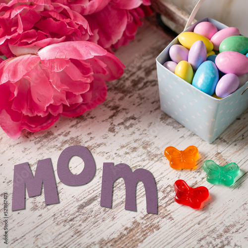 Mother's Day tray with flowers, candy, and construction paper 