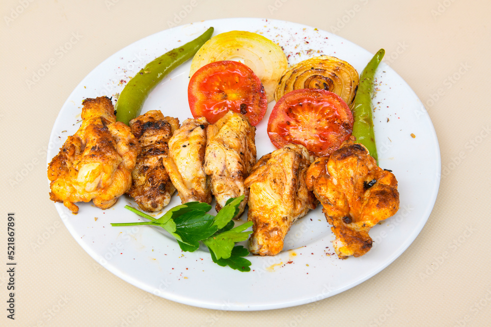 Chicken wings barbeque in a dish with BBQ grill sauce . Izgara tavuk kelebek sis kanat. Tavuk sis, gogus. Chicken wings barbeque in a dish with BBQ grill sauce . Izgara tavuk kelebek sis kanat. Tavuk sis, gogus.