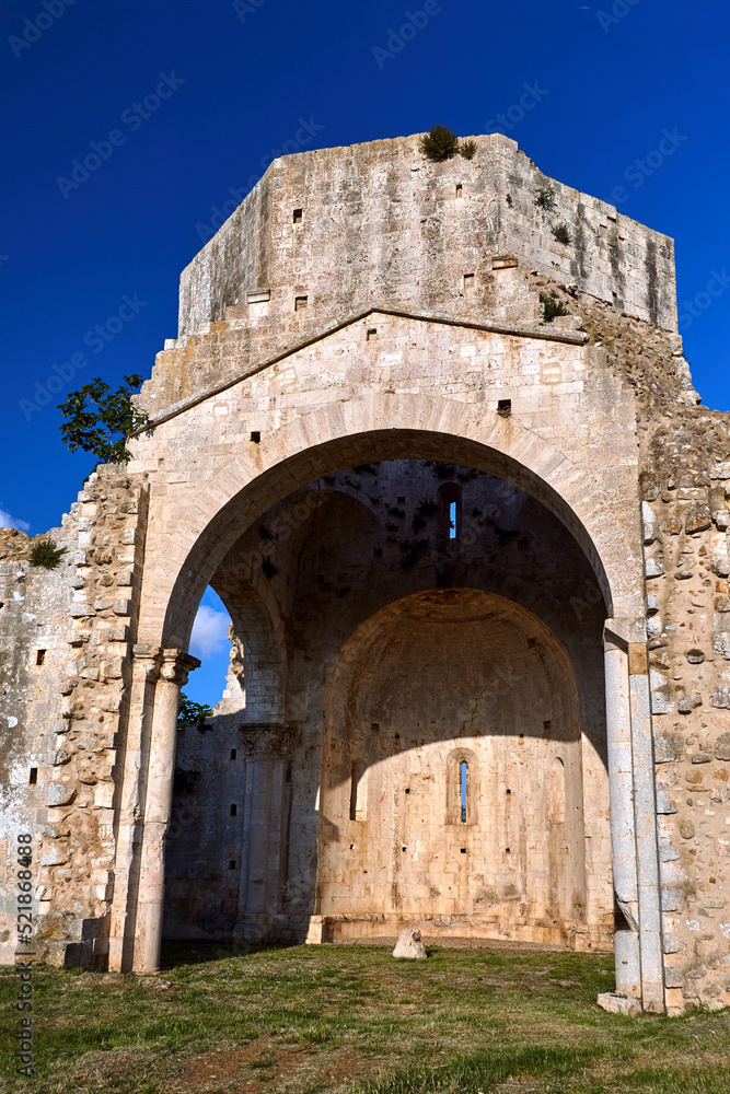 Ruins of a medieval stone church next to the town of Magliano in Toscana