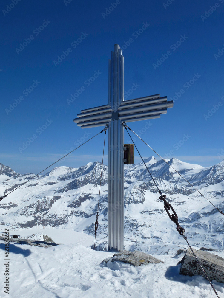 Summit cross Stubacher Sonnblick mountain, alpine ski tour, Tyrol, Austria