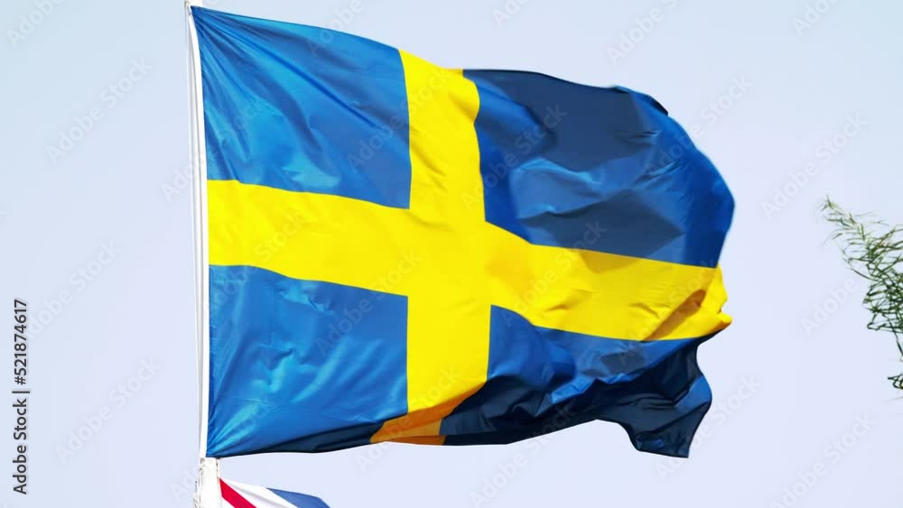 flag of Sweden. Sweden's national symbols. Swedish flag on a flagpole against the sky. European country flag