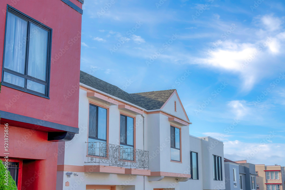 Row of houses with painted walls exterior against the sky in San Francisco, California