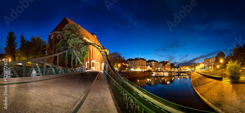 Night panorma of Ostrow Tumski. View from the Tumski bridge. May 2022 Wroclaw, Poland.
