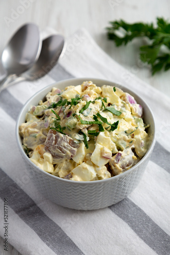 Homemade Healthy Potato Salad with Eggs in a Bowl, side view.