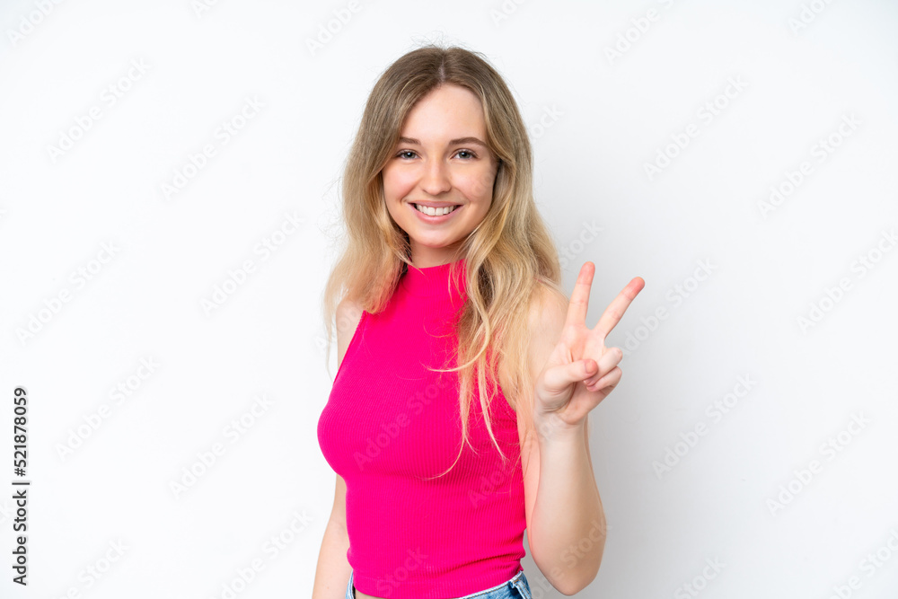 Blonde English young girl isolated on white background smiling and showing victory sign Blonde English young girl isolated on white background smiling and showing victory sign