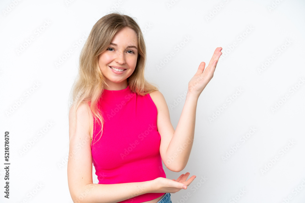Blonde English young girl isolated on white background extending hands to the side for inviting to come Blonde English young girl isolated on white background extending hands to the side for inviting to come