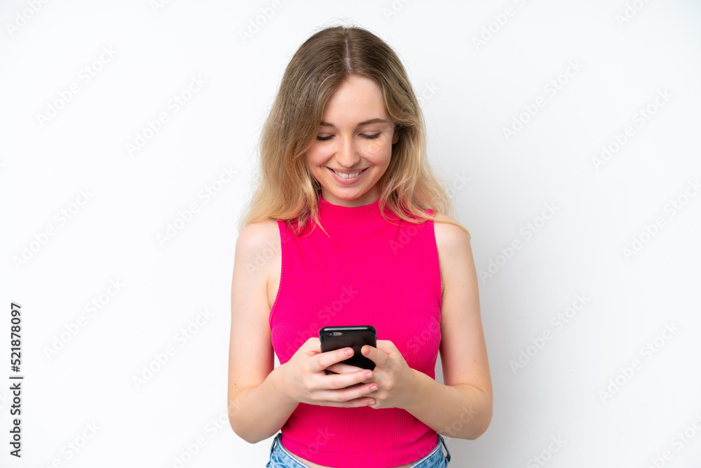 Blonde English young girl isolated on white background sending a message with the mobile Blonde English young girl isolated on white background sending a message with the mobile