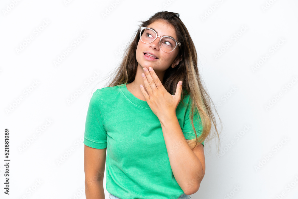 Young caucasian woman isolated on white background looking up while smiling Young caucasian woman isolated on white background looking up while smiling