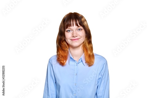 Smiling redhead teenage female on white isolated background