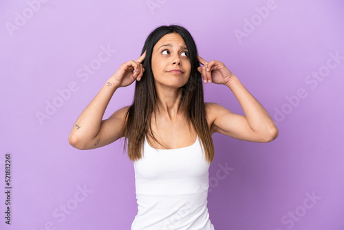 Young caucasian woman isolated on purple background having doubts and thinking