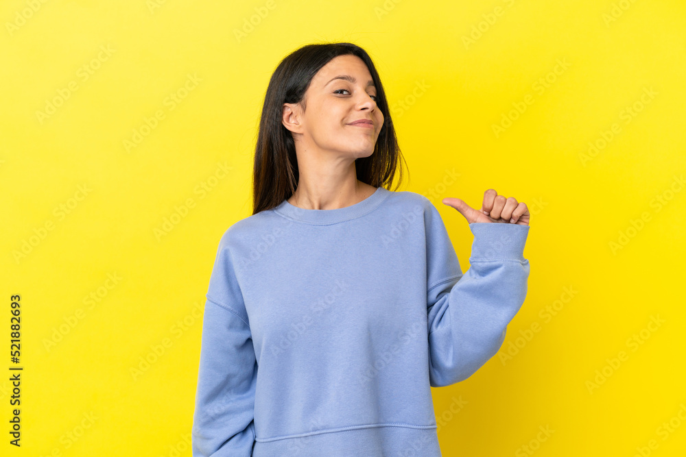 Young caucasian woman isolated on yellow background proud and self-satisfied Young caucasian woman isolated on yellow background proud and self-satisfied