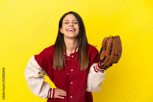 Photography Young caucasian woman playing baseball isolated on yellow background posing with