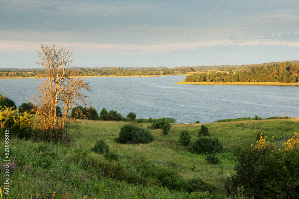 Serene landscape with a lake lake in the evening Serene landscape with a lake lake in the evening