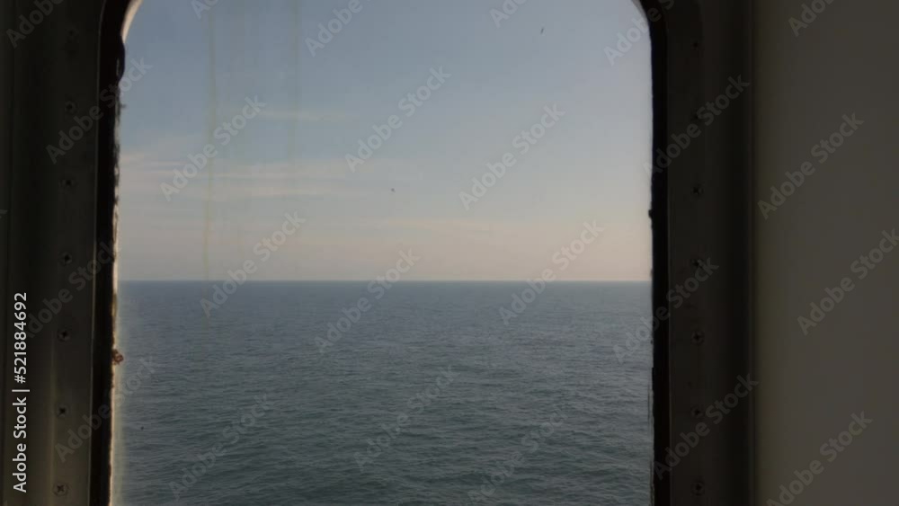 Baltic Sea horizon seen from porthole on moving ferry, 4k video footage Baltic Sea horizon seen from porthole on moving ferry, 4k video footage