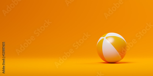 Orange and white striped inflatable toy game beach ball on orange background, summer vacation or beach symbol