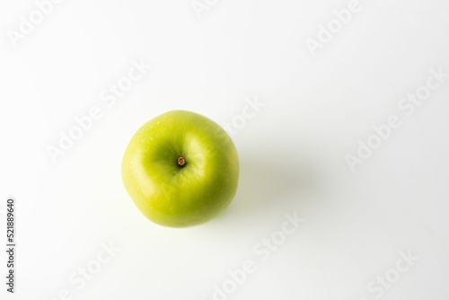 Top shot of a green ripe apple isolated on white background photo