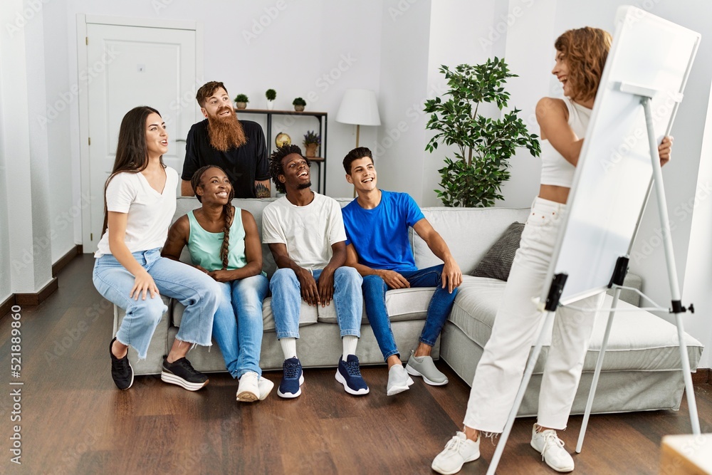 Group of young friends smiling happy playing drawing game at home. Group of young friends smiling happy playing drawing game at home.