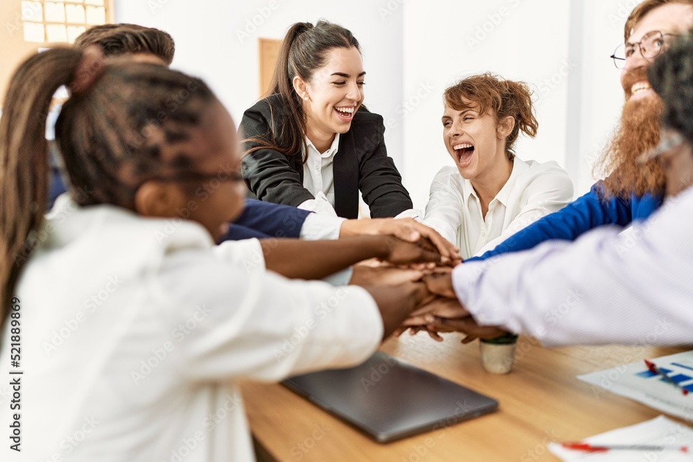 Group of business workers smiling happy celebrating with hands together at the office.