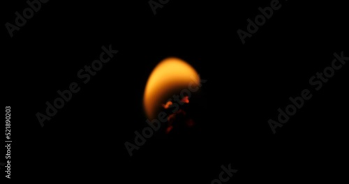 Bokem  of burning candle on black background, Blurry, macro shot of lit candle.  photo